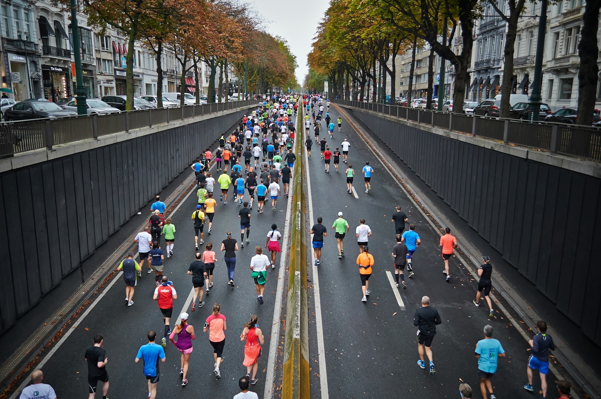 A runner performing a steady-state run in a calm, scenic outdoor environment.