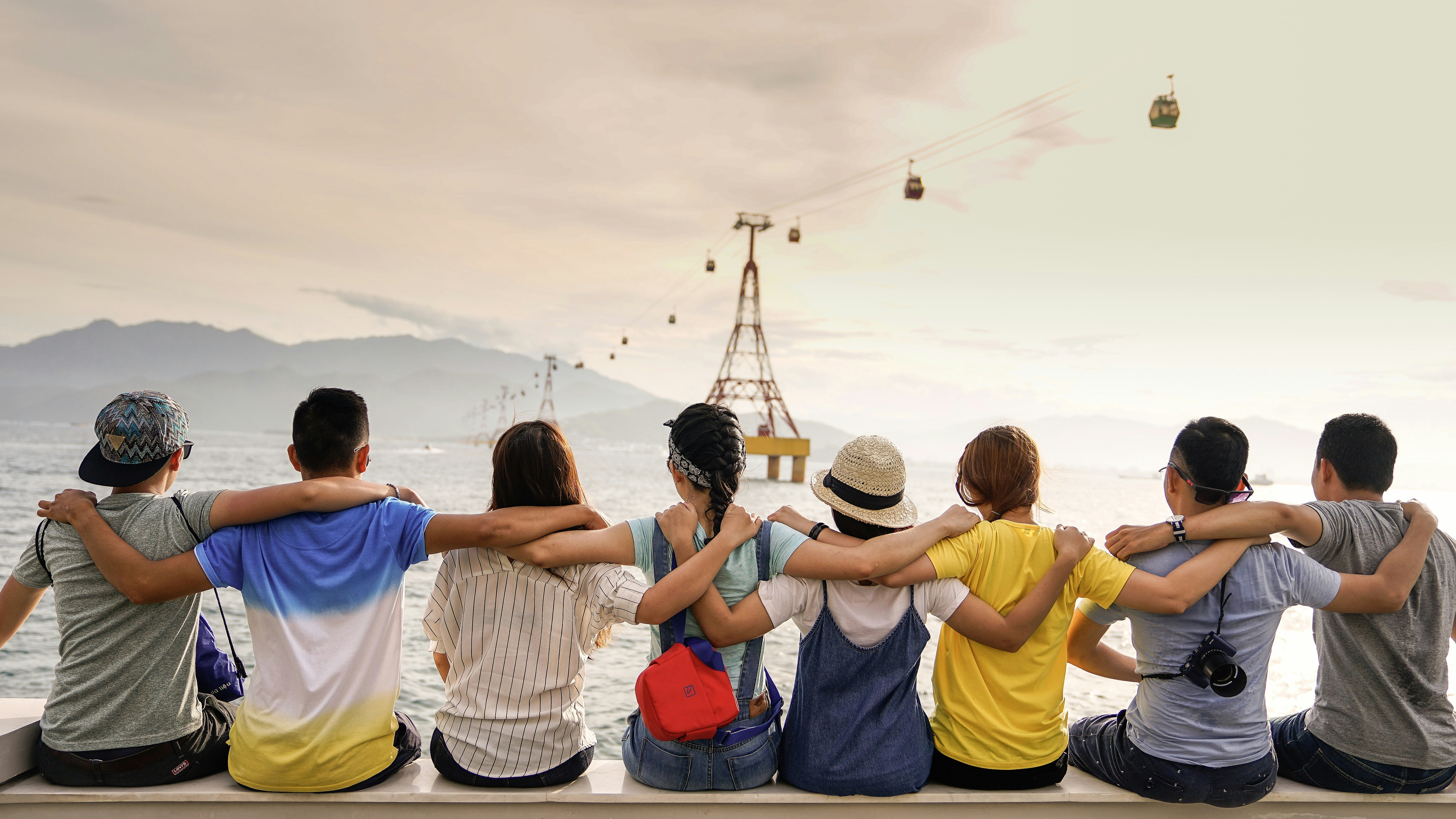 A group of diverse individuals sitting in a circle during a supportive community meeting.