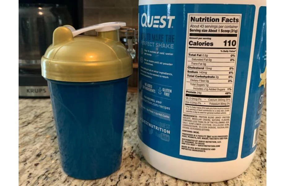 A close-up of a protein powder nutrition facts label showing ingredients and macronutrients.