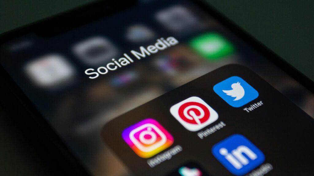 A smartphone screen filled with various social media application icons.