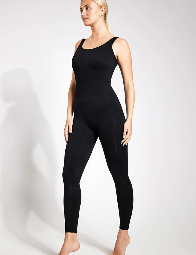 A front view of a black seamless unitard with thin straps.