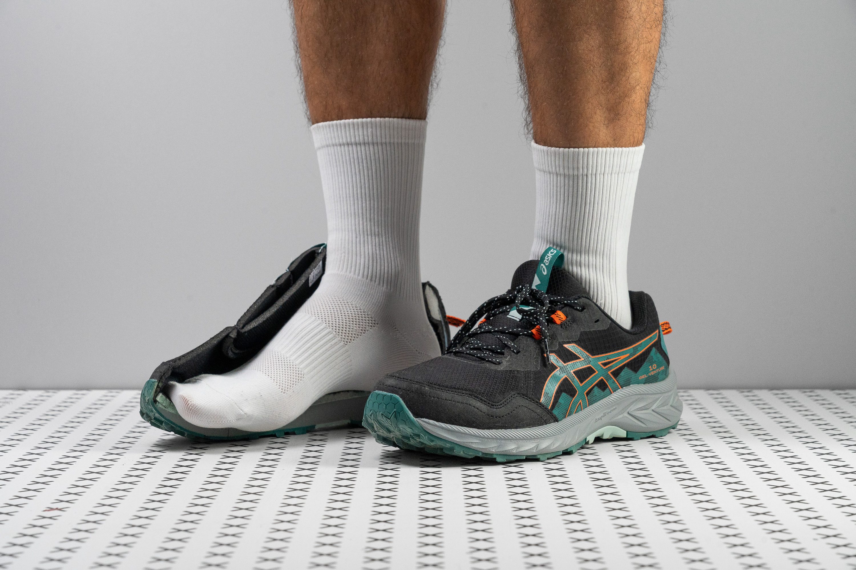 ASICS Gel Venture 10 trail shoe with aggressive outsole grip for uneven terrain.