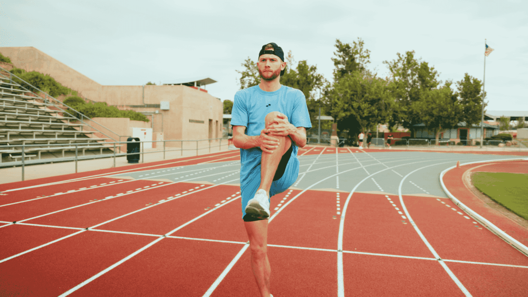A person performing a functional mobility exercise routine focused on joint fluidity.