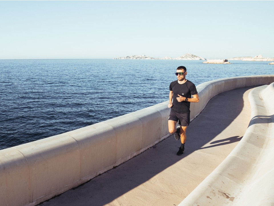 An athlete engaging in a run-walk interval training session on a path.