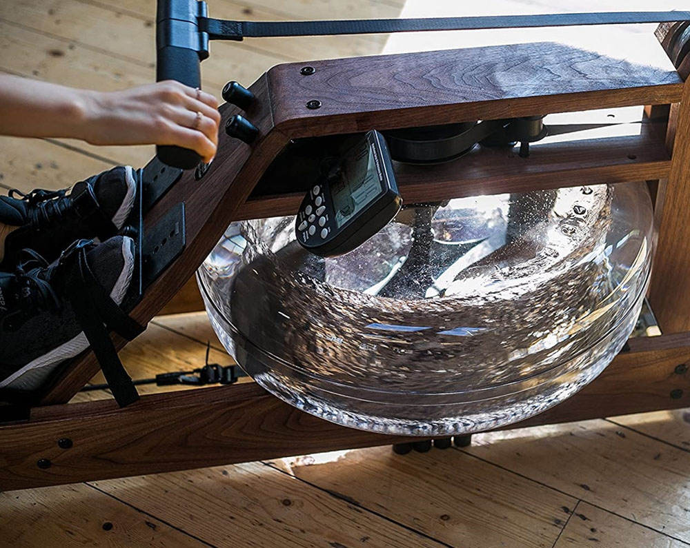 Detail of the WaterRower's teardrop-shaped handle and the black polyester drive strap.