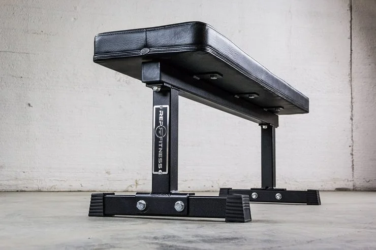 A sturdy black REP Fitness heavy duty flat weight bench.