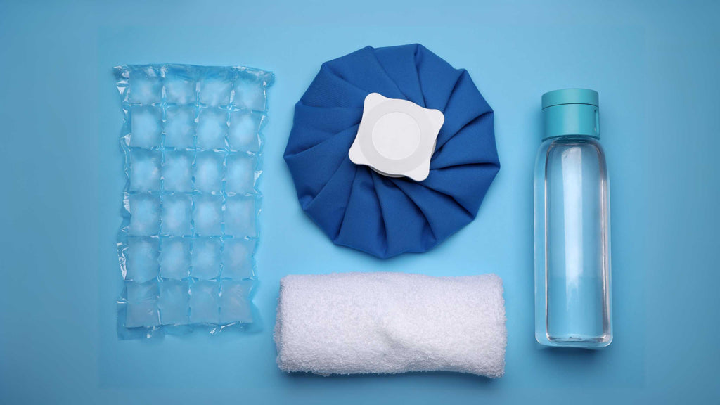 A close-up of a cold compress and ice cubes used for soothing inflamed skin.