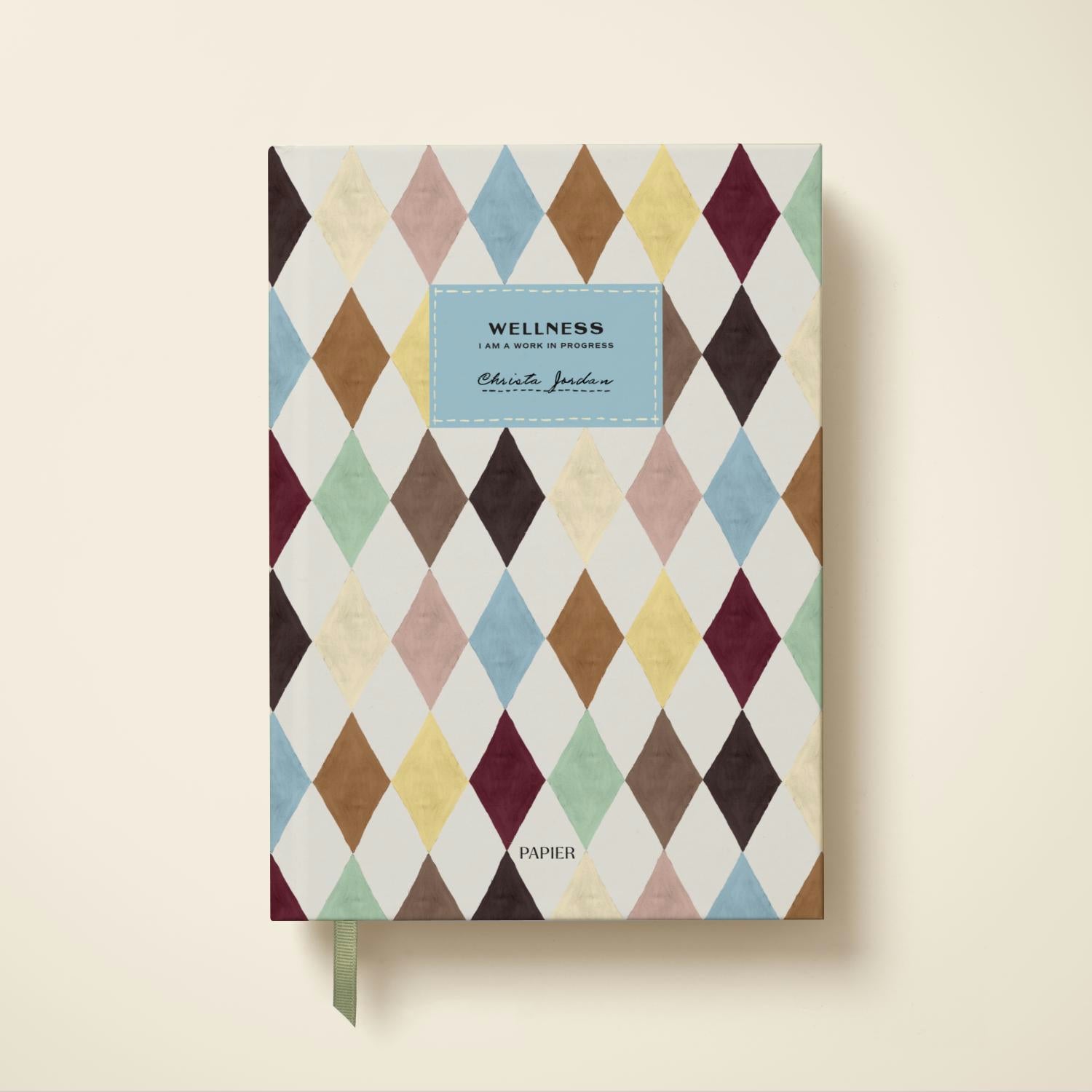 A minimalist Papier wellness journal with a beige cover and clean typography.