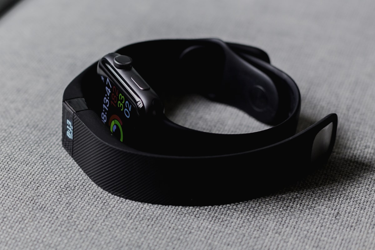 A close-up of a person using a smartwatch to track health metrics and nutritional data.
