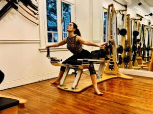 A demonstration of the spiraling movement patterns and circular range of motion used in Gyrotonic exercises.