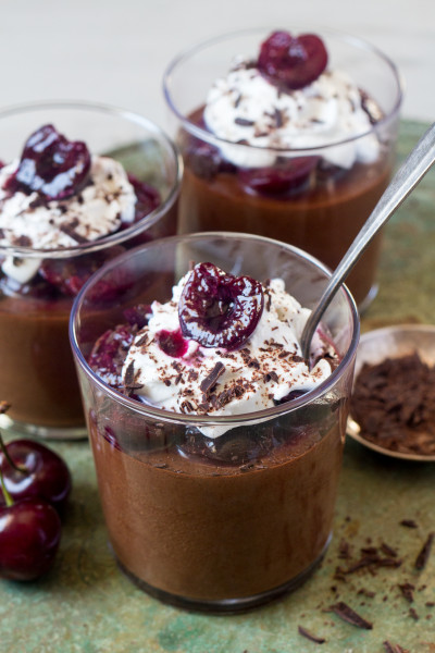 Vegan chocolate mousse layered with dark cherries, showcasing a Black Forest style variation.