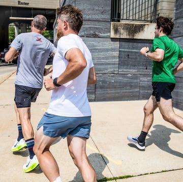 A group of runners wearing moisture-wicking athletic shorts and performance tops.