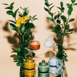Modern ceramic candle vessels from the Paddywax Beam collection on a neutral surface.