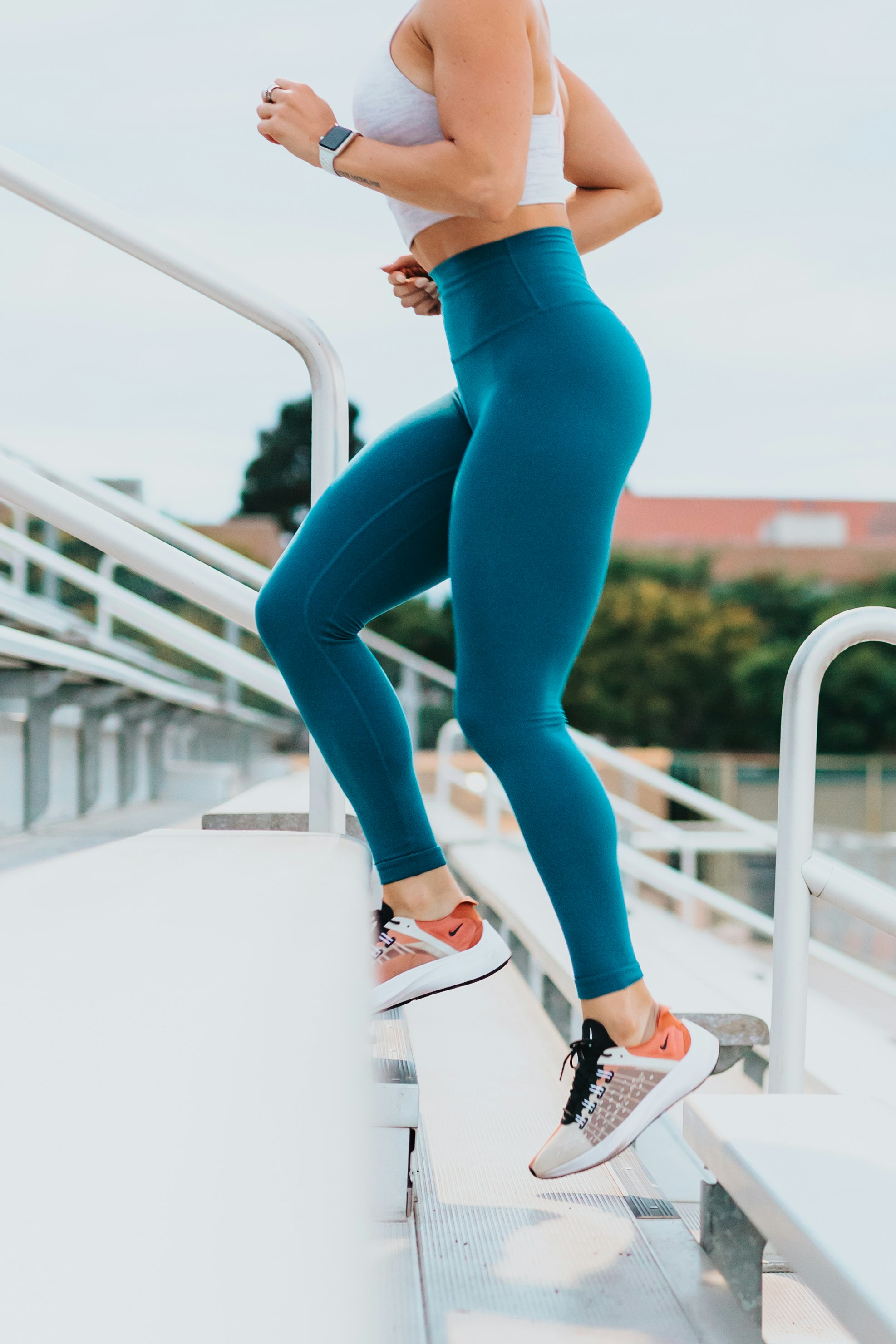 A person jogging through a park to maintain heart health.