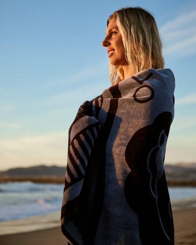 An Outerknown organic cotton beach towel with a sustainable design.