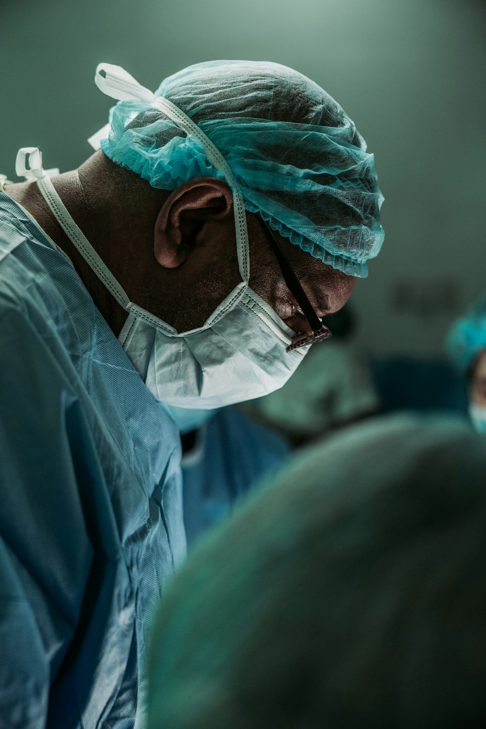 A person holding their neck in pain, indicating a severe sore throat.