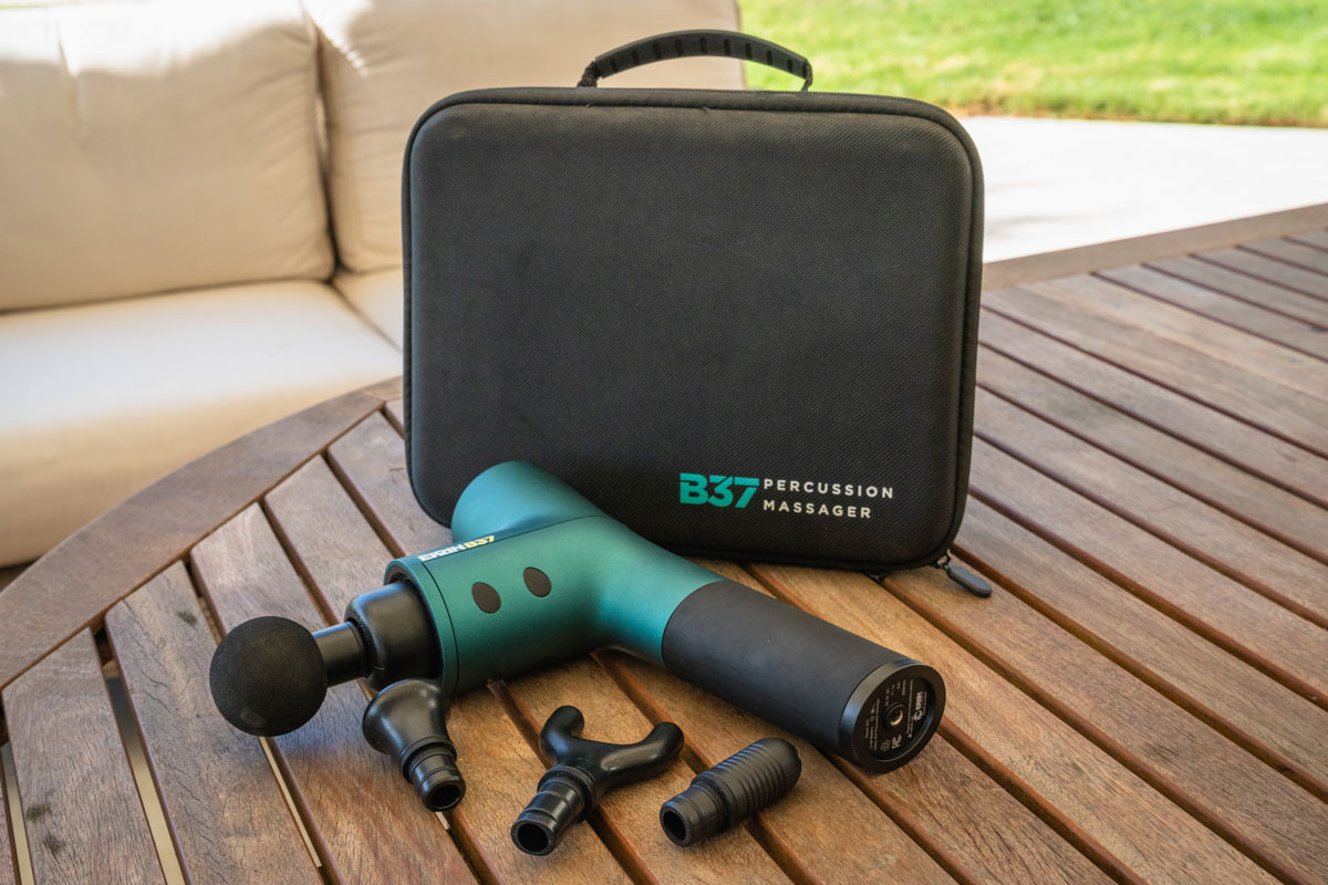 Different attachment heads for an Ekrin Athletics B37S percussive massager.