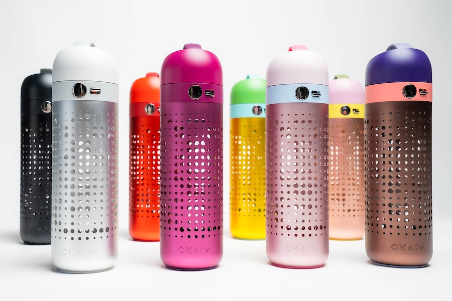 Modern and stylish glass water bottles with protective sleeves.