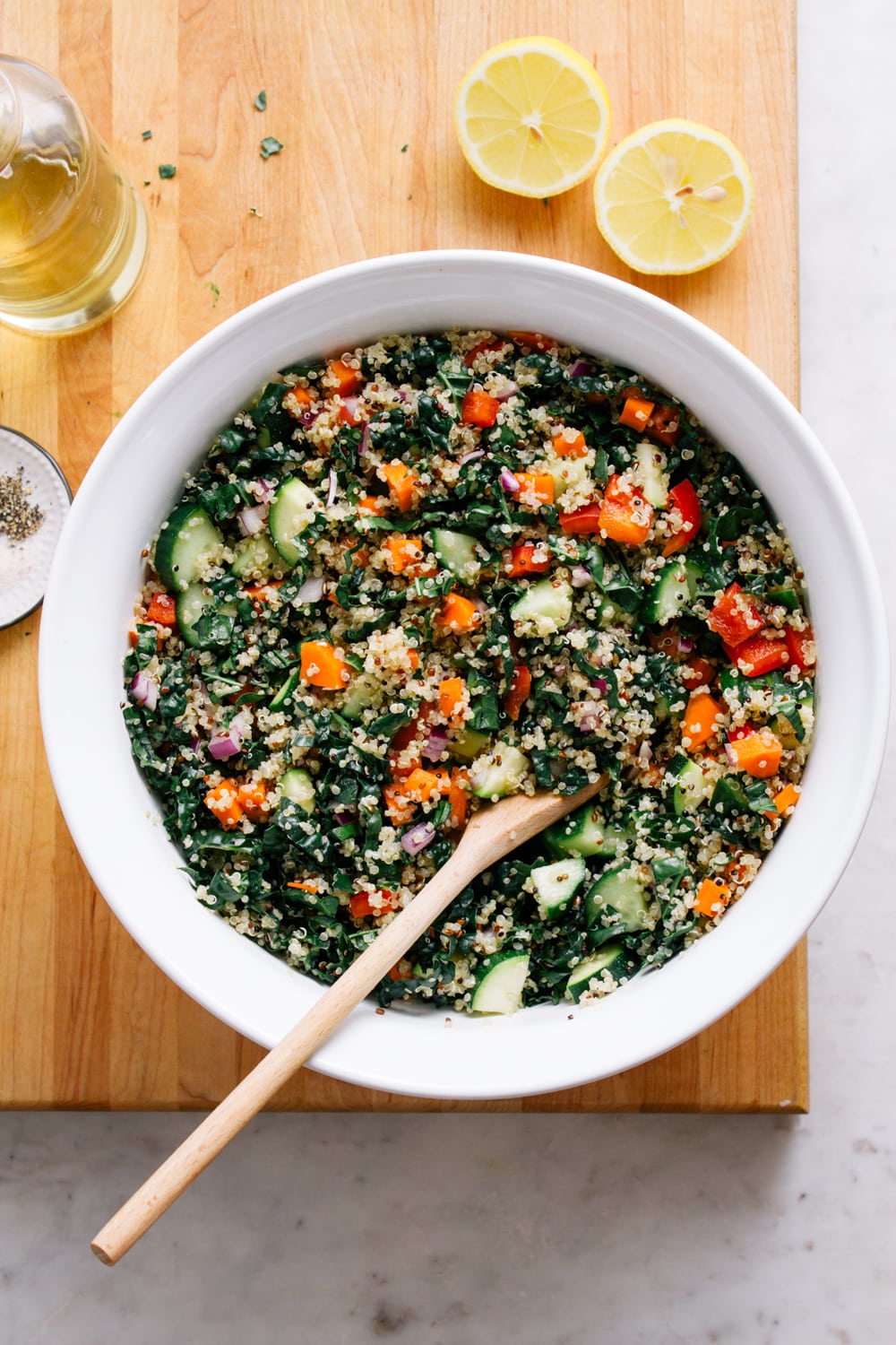 A close-up of the completed kale and quinoa salad, tossed and ready to serve.