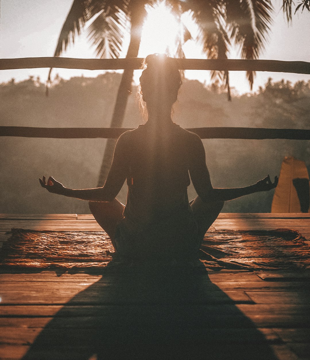 A person practicing calm meditation or breathing exercises in a tranquil room.