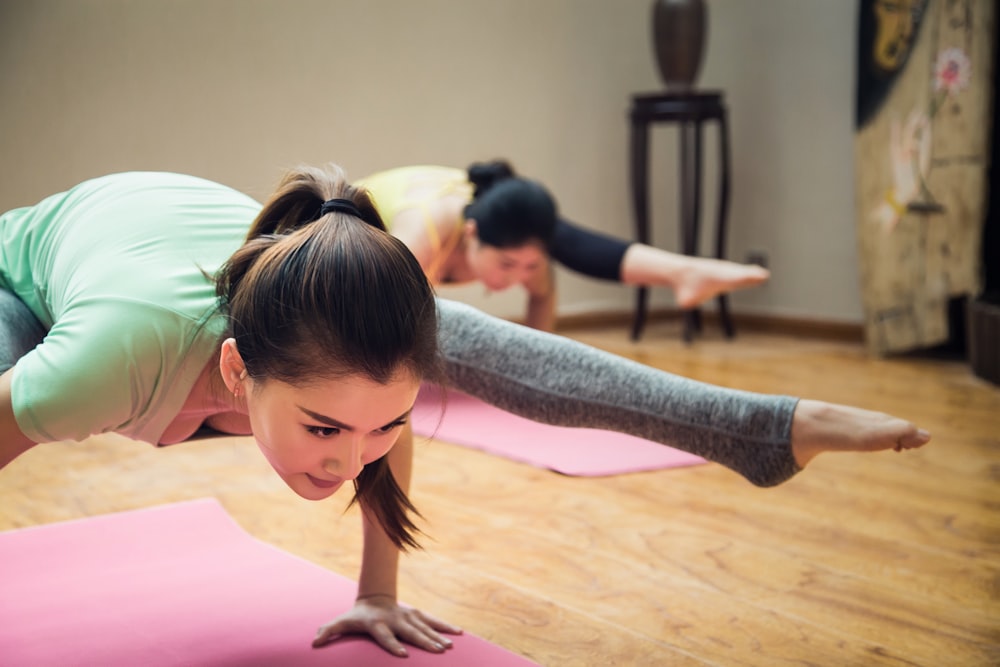 A person sitting with one hand on their chest and the other on their belly to demonstrate diaphragmatic breathing.
